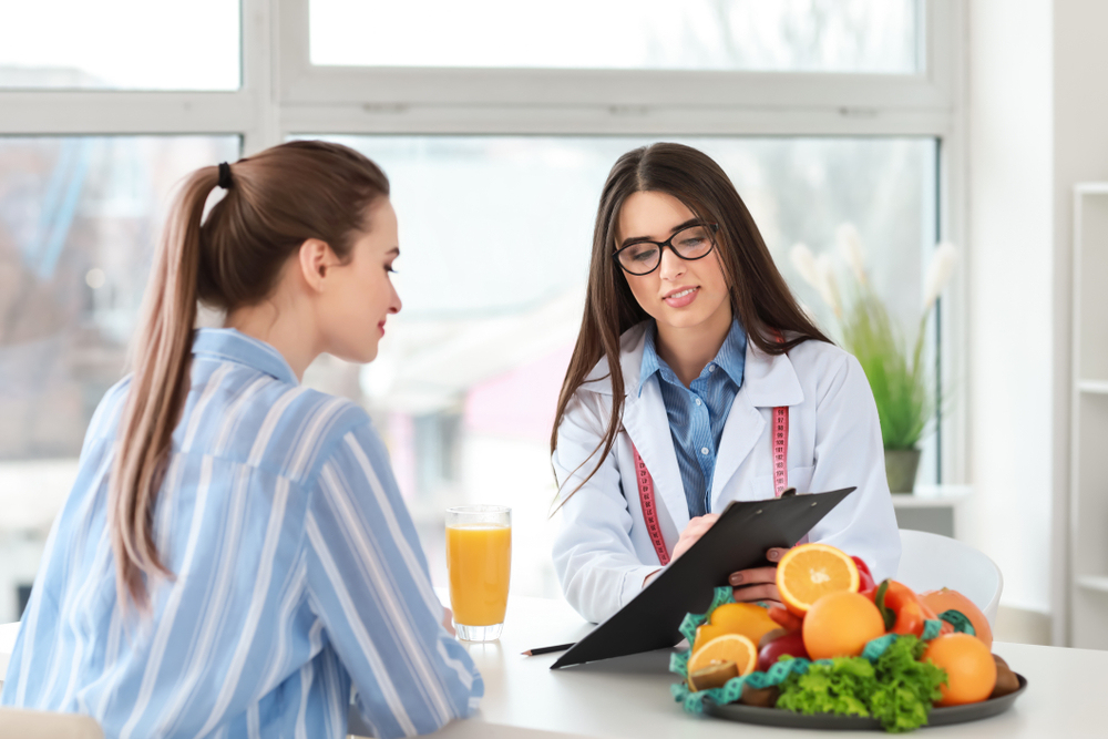 Medical weight loss in Ellicott City MD consultation with doctor and patient discussing healthy diet plans